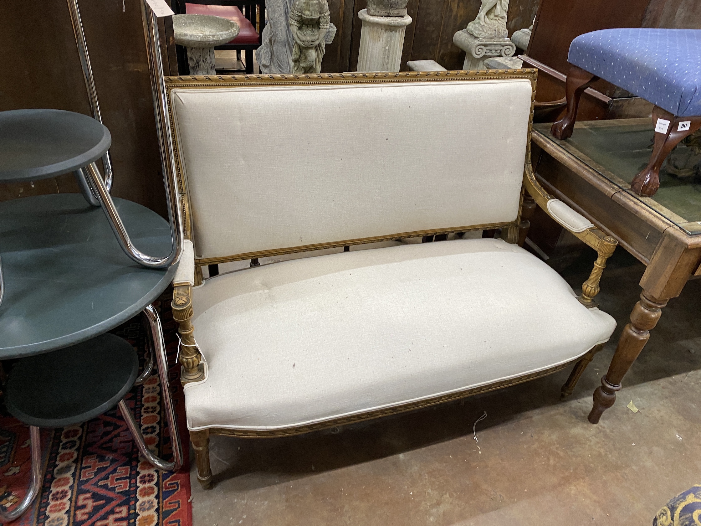 A late 19th century Louis XVI style giltwood settee, width 124cm, depth 52cm, height 96cm